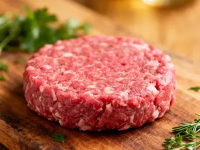 Raw ground lamb patty