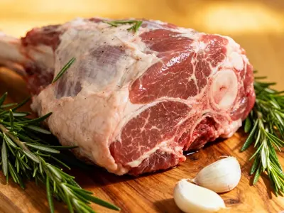 Raw bone-in lamb shoulder roast