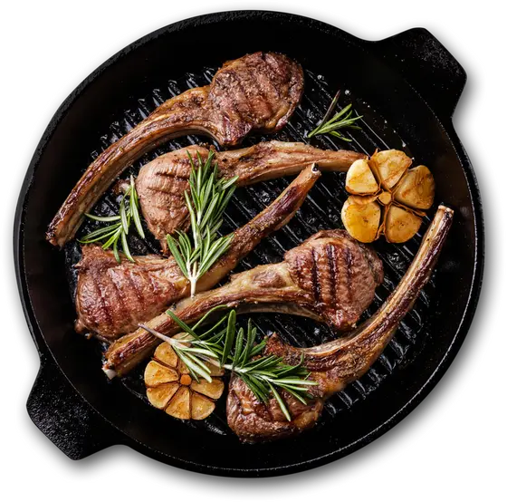 Seared lamb chops with rosemary and garlic in a cast iron skillet